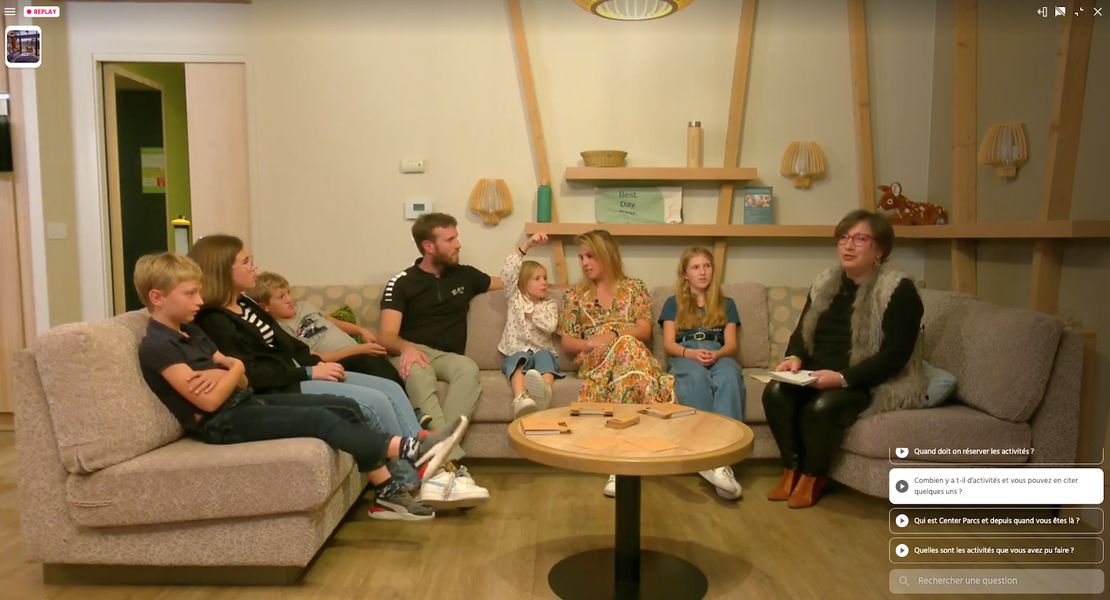 A Center Parcs Live Shopping selling holiday stays: a large family in a living room shares their experience with a presenter